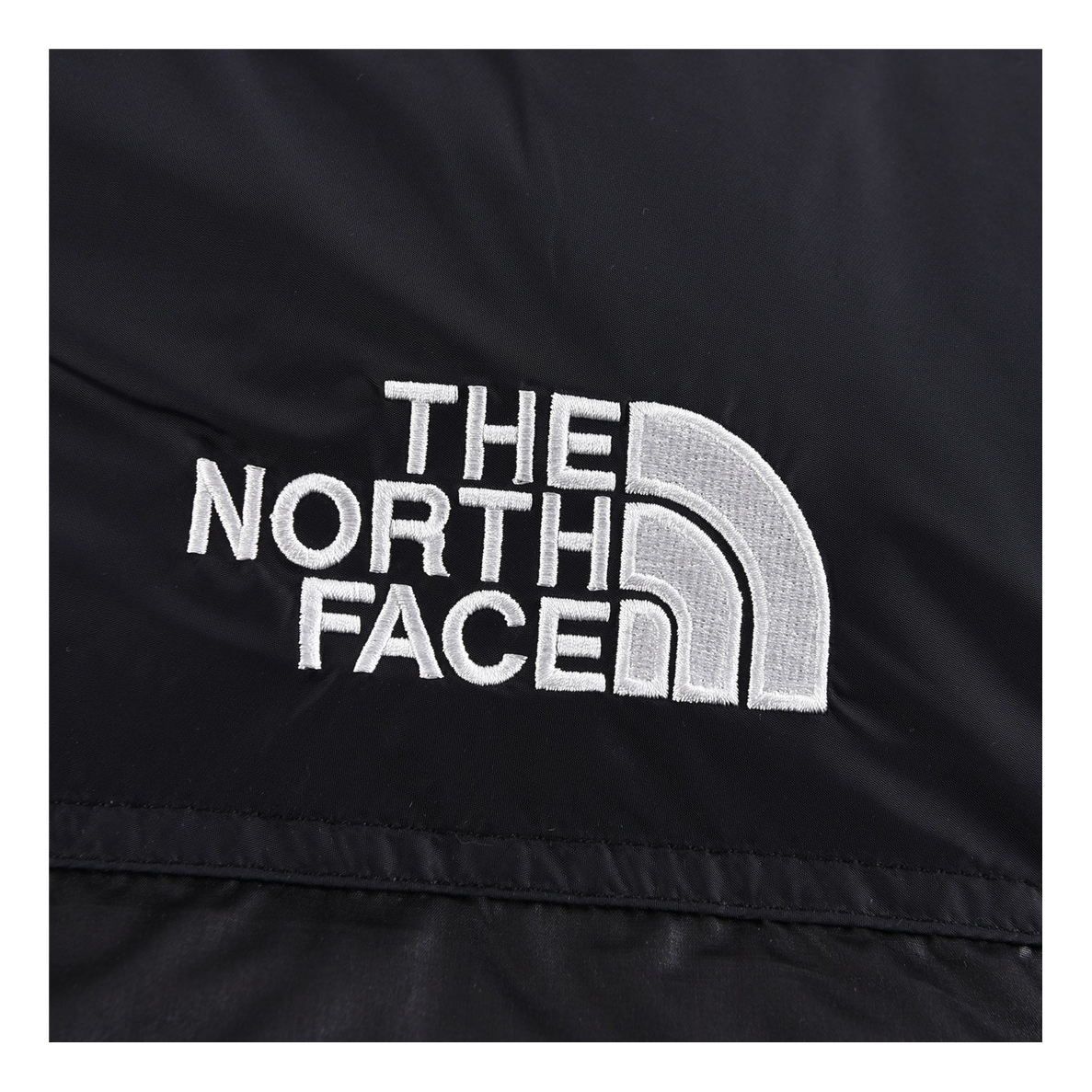 The North Face Contrast-Panel Stand-Collar Puffer Jacket – Bold Two-Tone Design
